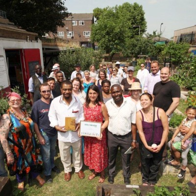 The Growing Kitchen Project was given the award by Dharmendra Kanini, director of England Big Lottery Fund at Wenlock Barn Estate in Napier Grove in Hoxton